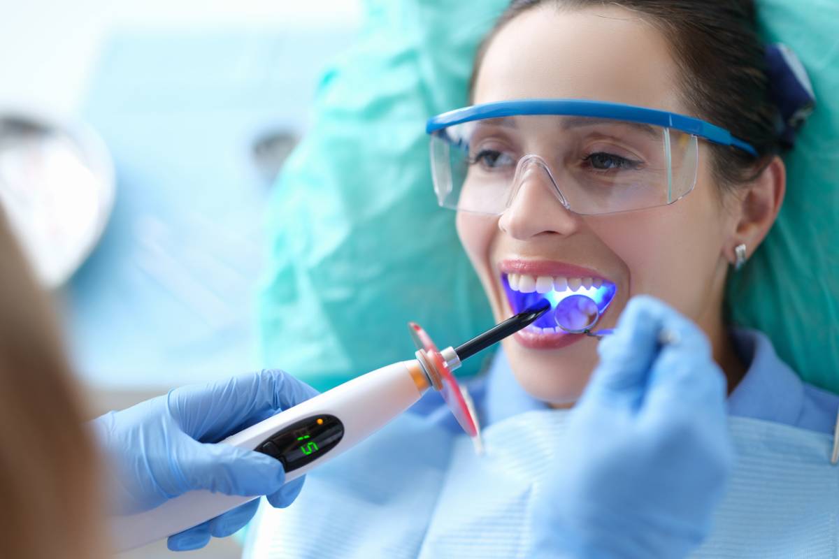 Female patient having dental bonding