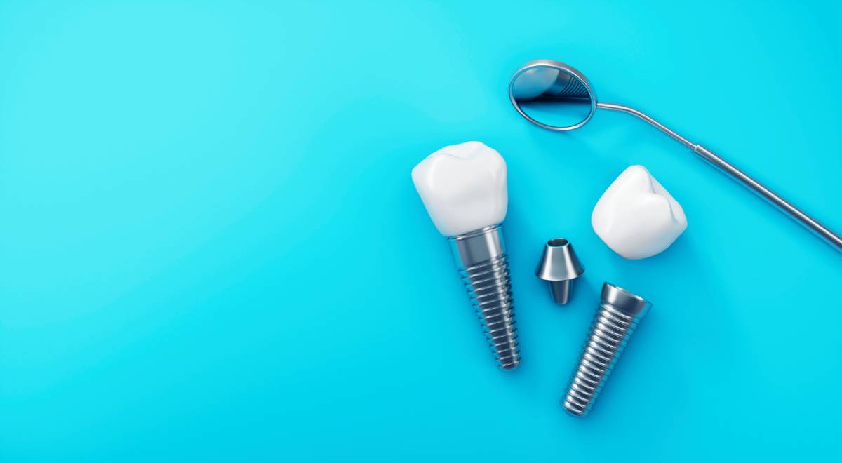 Concept image of dental implants on blue background